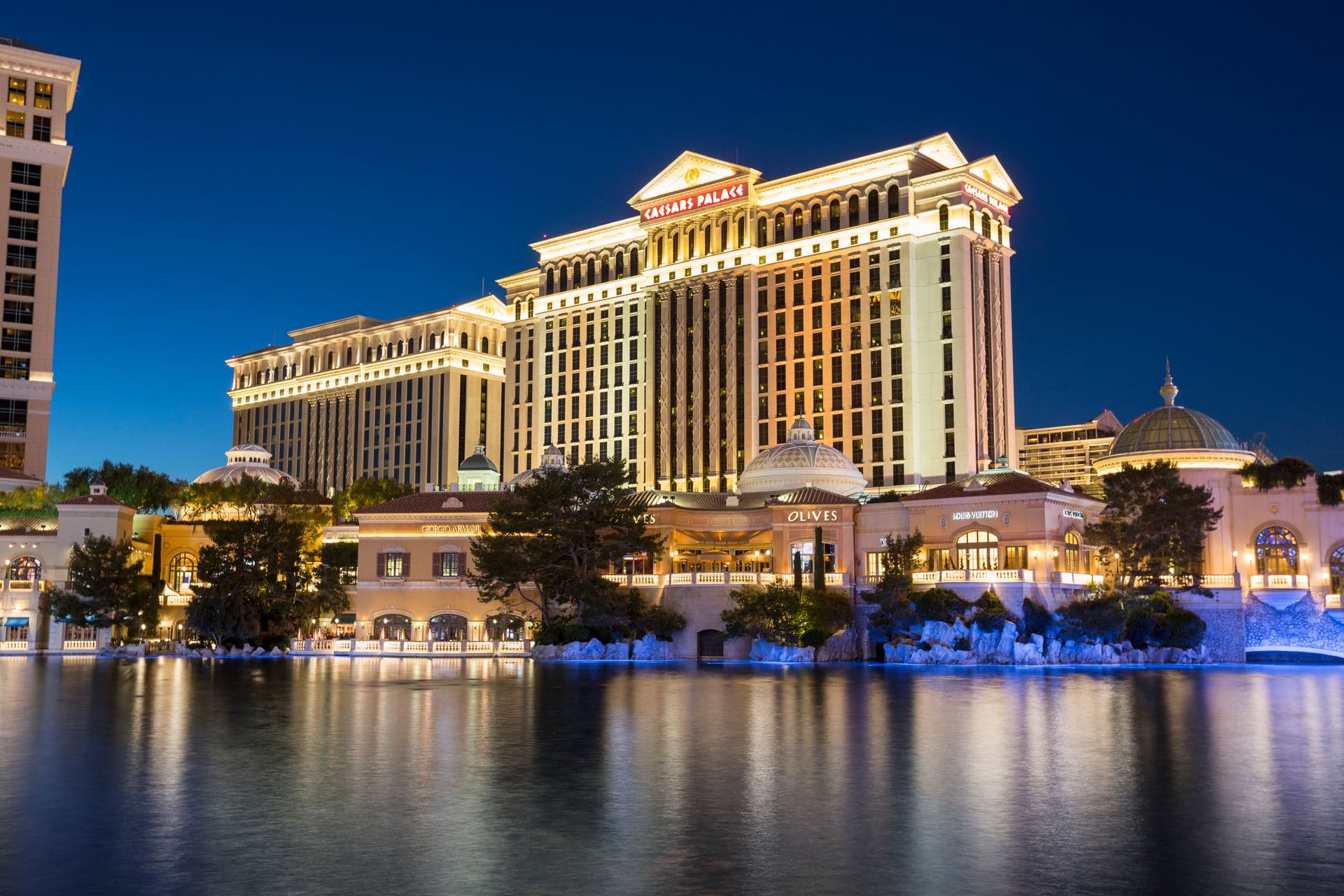 Caesars Palace hotel lit up at night in Las Vegas